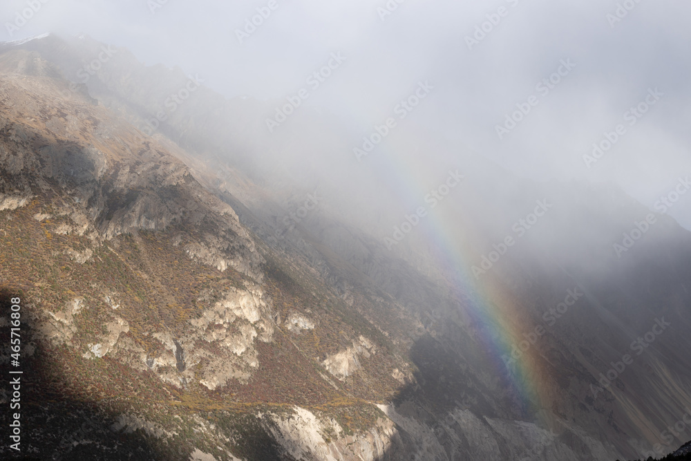 Beautitufl rainbow with winter landscape in tibet,China