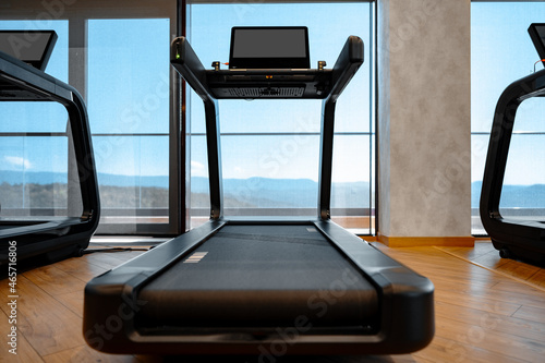 Fotografie Studio shot of a professional treadmill in modern gym