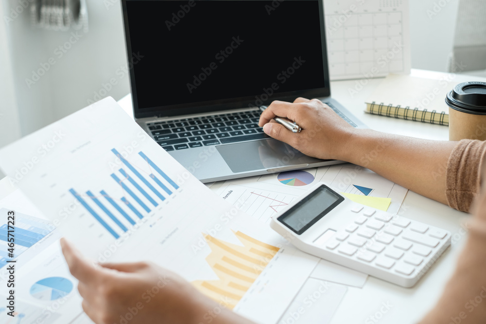 work from home, The hand of a woman who works in finance sits at his desk at home and calculates financial graphs showing the results of his investments, planning the steps of his business growth work from home, The hand of a woman who works in finance sits at his desk at home and calculates financial graphs showing the results of his investments, planning the steps of his business growth