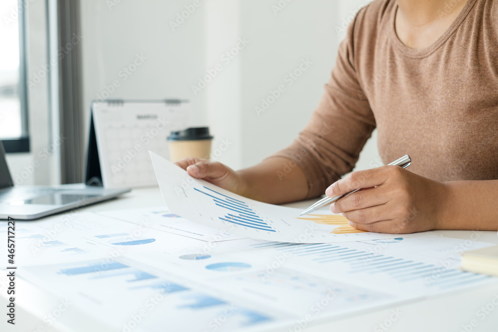 work from home, The hand of a woman who works in finance sits at his desk at home and calculates financial graphs showing the results of his investments, planning the steps of his business growth work from home, The hand of a woman who works in finance sits at his desk at home and calculates financial graphs showing the results of his investments, planning the steps of his business growth