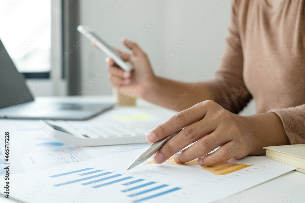 work from home, The hand of a woman who works in finance sits at his desk at home and calculates financial graphs showing the results of his investments, planning the steps of his business growth work from home, The hand of a woman who works in finance sits at his desk at home and calculates financial graphs showing the results of his investments, planning the steps of his business growth