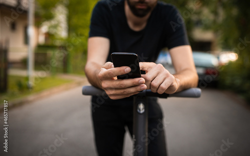 Close up of man hands holding a smart phone on the street