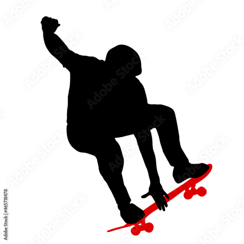 Black silhouette of an athlete skateboarder in a jump