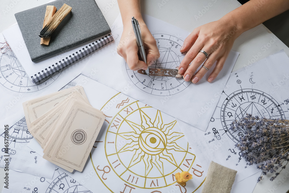 Astrology. Astrologer calculates natal chart and makes a forecast of fate.Tarot cards, Fortune telling on tarot cards magic crystal, occultism, Esoteric background. Fortune telling,tarot predictions. - obrazy, fototapety, plakaty 