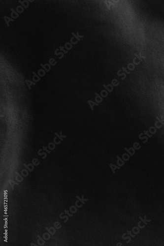 Black fabric sheets background or texture.