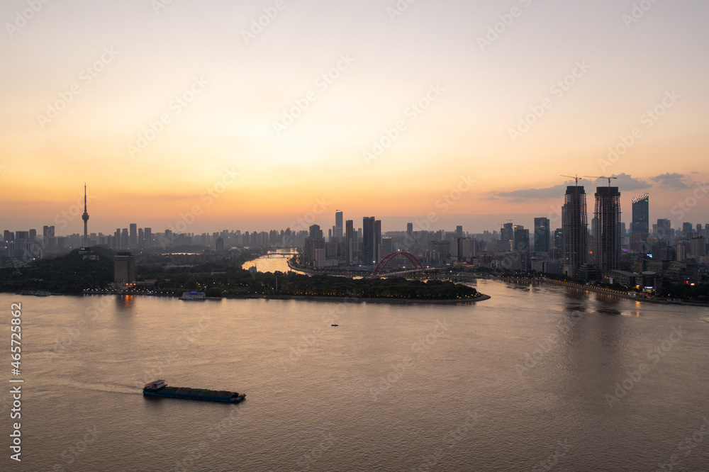 Wuhan skyline and Yangtze river with supertall skyscraper under construction in Wuhan Hubei China.	