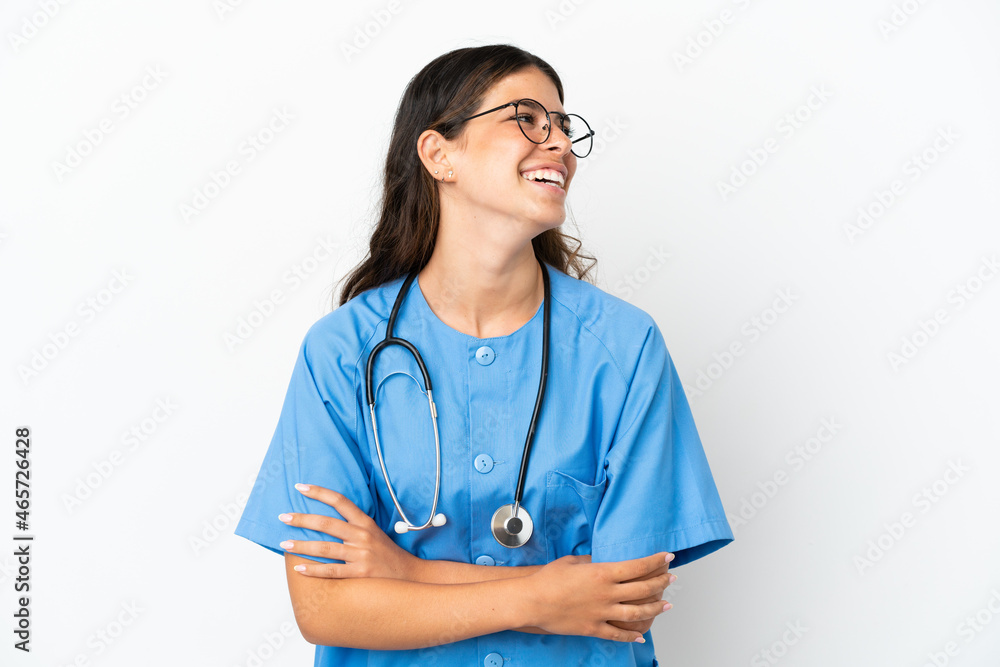 Young surgeon doctor caucasian woman isolated on white background happy and smiling Young surgeon doctor caucasian woman isolated on white background happy and smiling