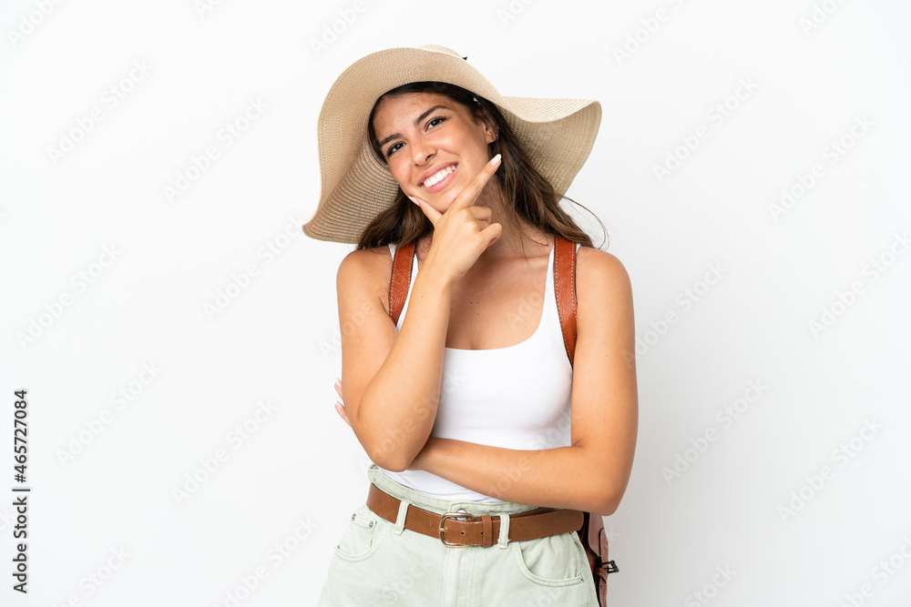 Young caucasian woman wearing a Pamela in summer holidays isolated on white background smiling Young caucasian woman wearing a Pamela in summer holidays isolated on white background smiling
