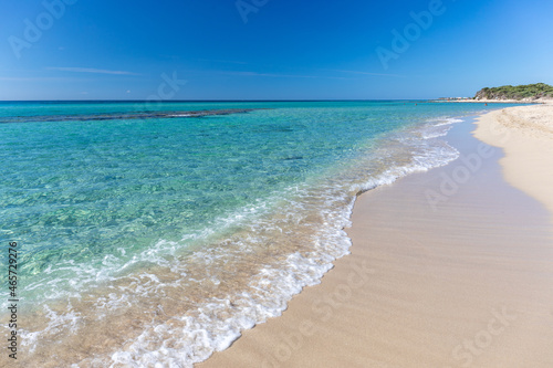 Scenic view of a beautiful beach with transparent water in Porto Cesareo Italy photo