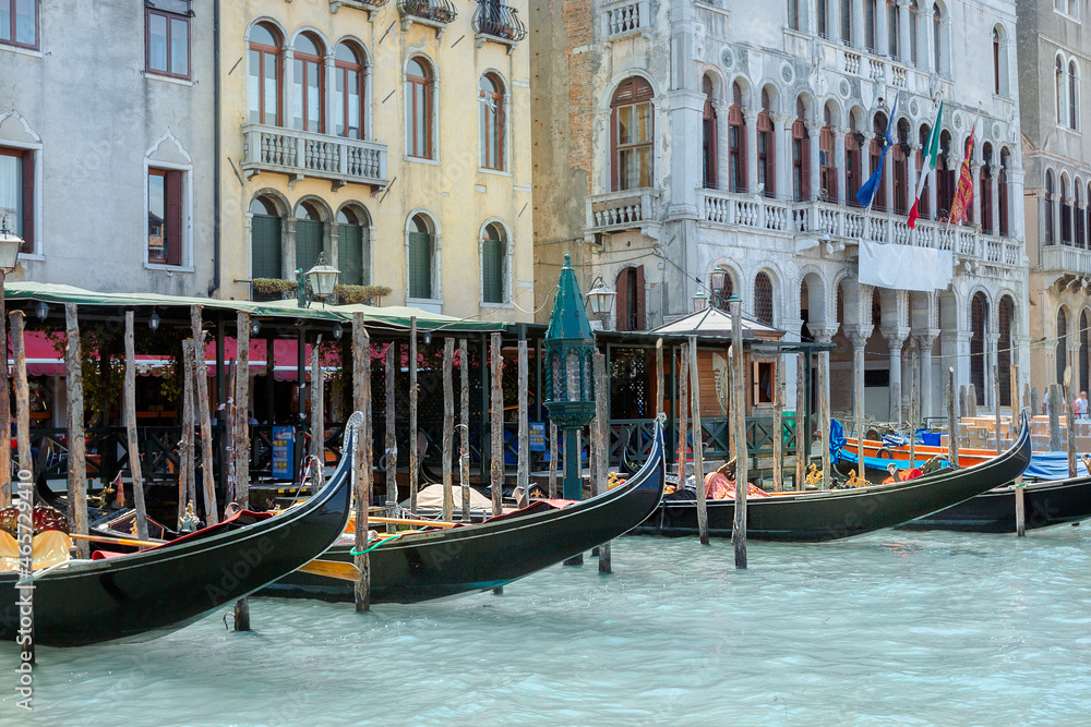 View of architecture and gondolas of Venice from Grand Canal. Beautiful colorful houses on narrow water streets, Venice, Italy. High quality photo