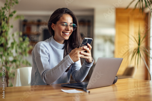 Happy caucasian woman, checking the online news photo