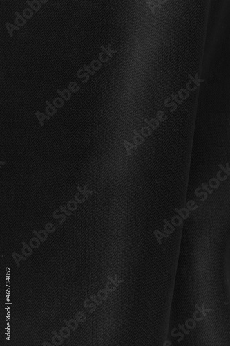 Black fabric sheets background or texture.