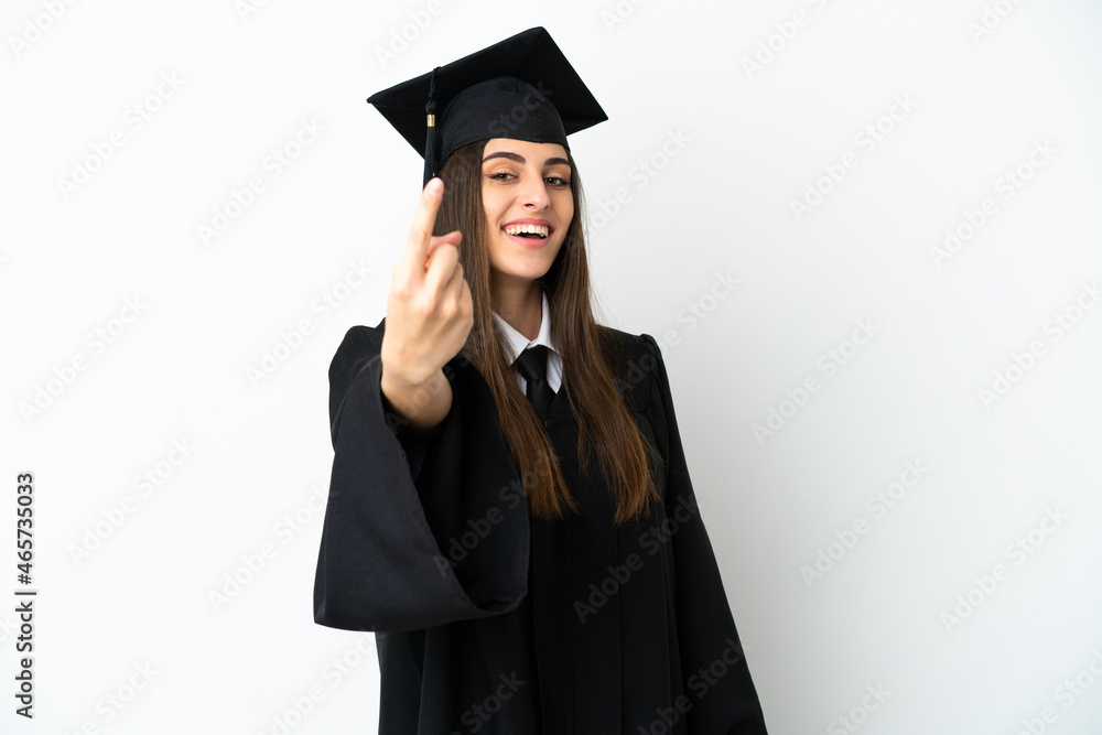 Young university graduate isolated on white background doing coming gesture Young university graduate isolated on white background doing coming gesture