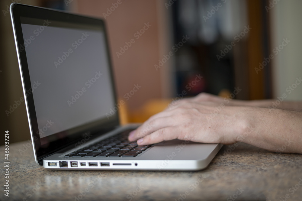 person typing on a laptop computer. Work from home. person typing on a laptop computer. Work from home.