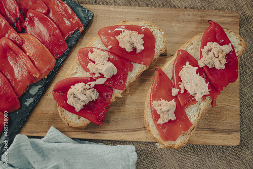 Spanish tapa of escalibada with peppers and tuna. photo