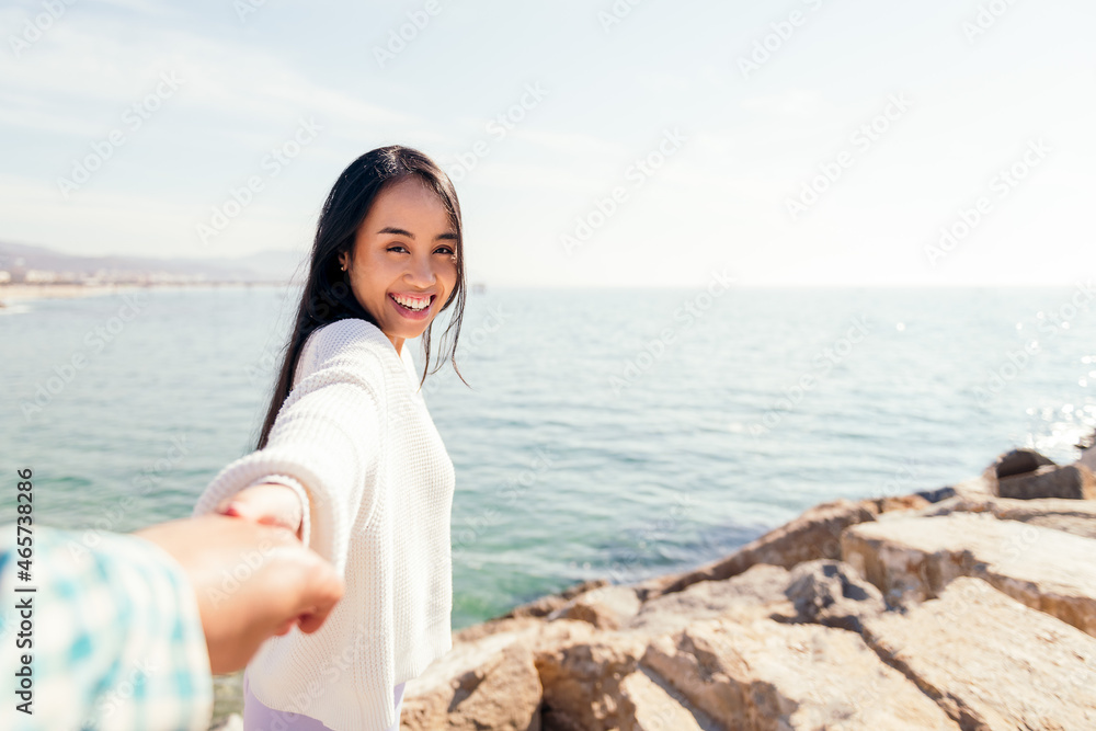 happy young asian woman holds hands with her love partner, concept of love and romanticism happy young asian woman holds hands with her love partner, concept of love and romanticism