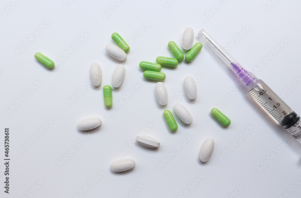 Assorted medical drugs and syringe on white background
Assorted medical drugs and syringe on white background