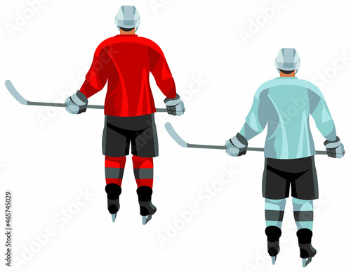 Hockey player in a sports uniform stands with his back straight and holds a stick in his hands