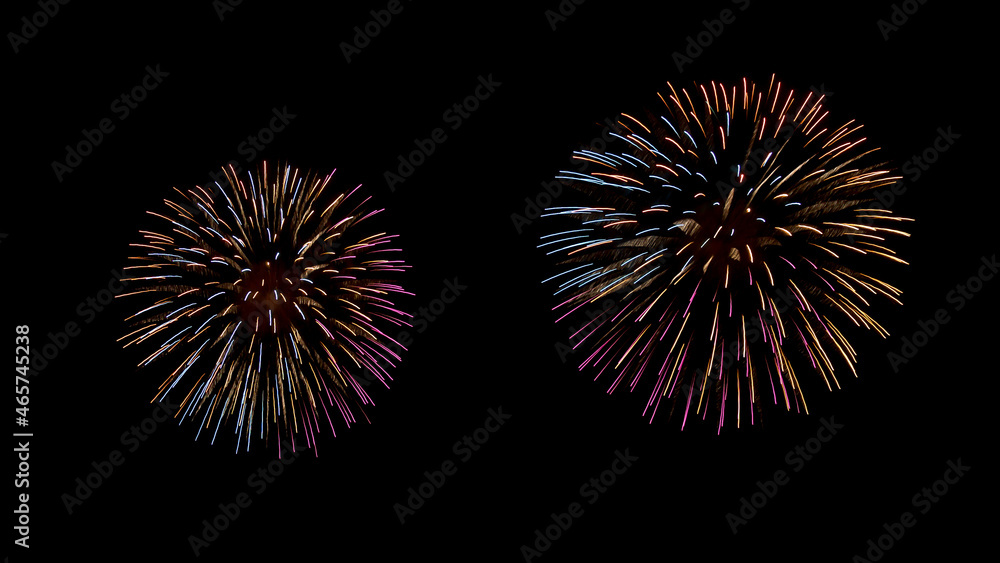 Fireworks on night sky, abstract light patterns. Black background with colorful, lightning effects. Long exposure and movement. Backdrops for Happy New Year cards, montage, copy space. 