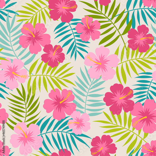 Pink hibiscus and palm leaf seamless pattern background.