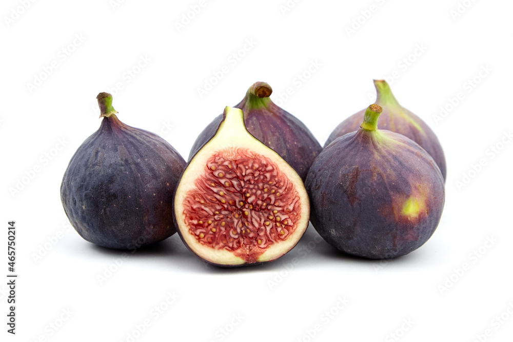 Fig fruit with ripe red halves isolated on white Fig fruit with ripe red halves isolated on white