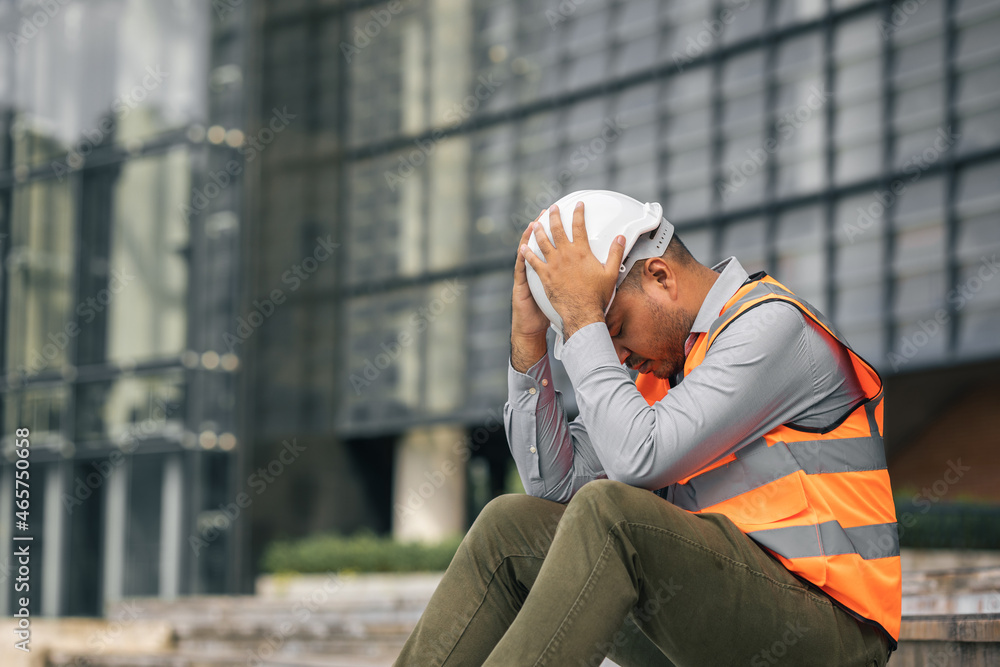 Worker hard working at construction site he tired and disconsolate. The civil engineer made a mistake, he was very stressed. Damage the structure of the building causing a breakdown. Worker hard working at construction site he tired and disconsolate. The civil engineer made a mistake, he was very stressed. Damage the structure of the building causing a breakdown.