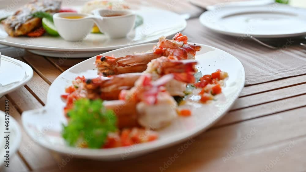 Grilled prawns with seasoning spicy sauce on dining table Grilled prawns with seasoning spicy sauce on dining table