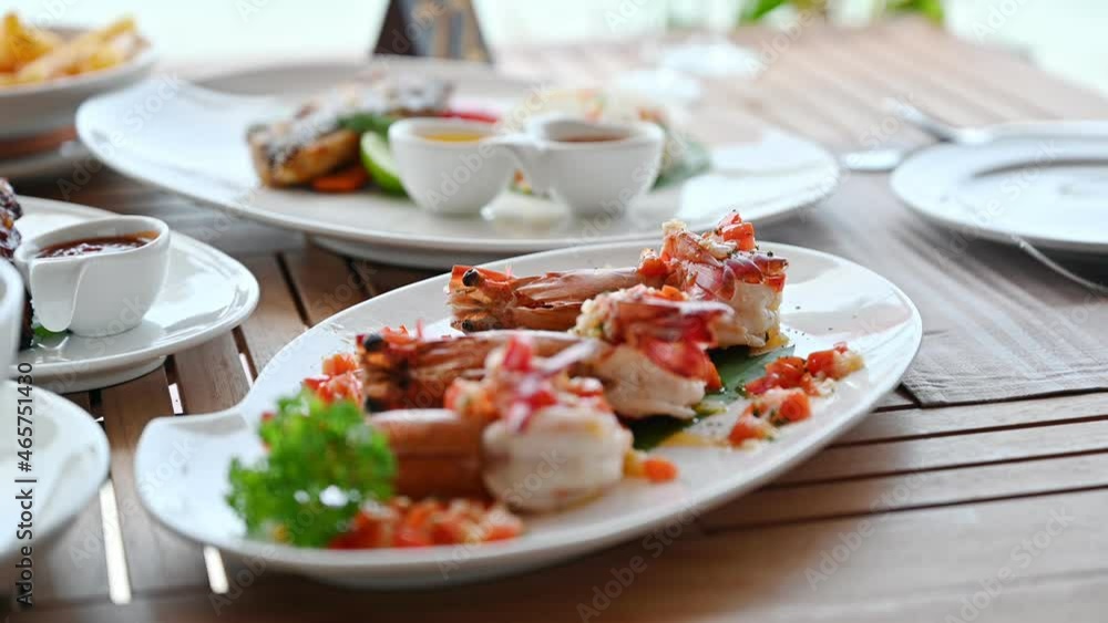 Grilled prawns with seasoning spicy sauce on dining table Grilled prawns with seasoning spicy sauce on dining table