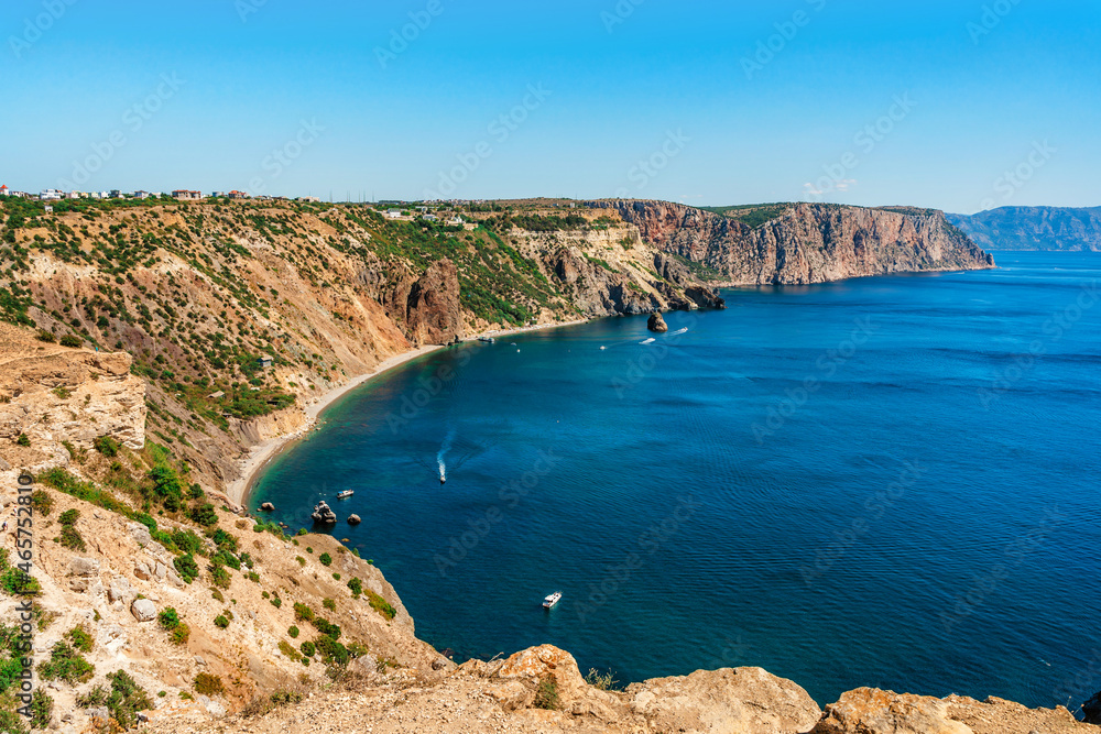 Panoramic sea view on Cape Fiolent in Crimea. A famous place for tourists on the Black Sea coast with azure water