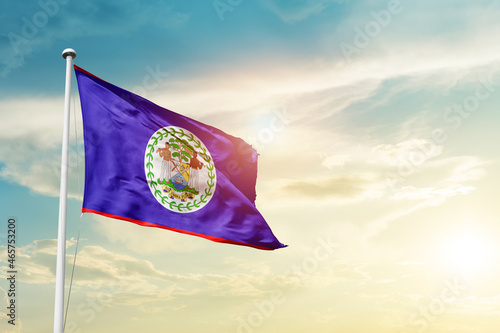 Belize national flag cloth fabric waving on the sky - Image