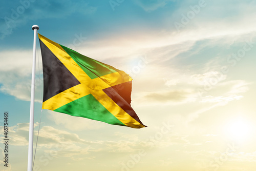 Tablou canvas Jamaica national flag cloth fabric waving on the sky - Image