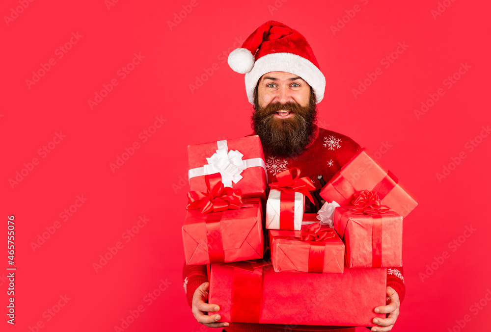 brutal man hold present box. bearded hipster in xmas sweater. christmas online shopping. happy man with beard in santa claus hat. winter holiday party. mature guy celebrate new year. copy space brutal man hold present box. bearded hipster in xmas sweater. christmas online shopping. happy man with beard in santa claus hat. winter holiday party. mature guy celebrate new year. copy space