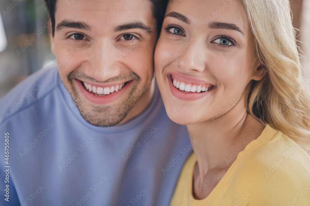 Photo of attractive sweet young couple wear casual outfits smiling embracing indoors house room Photo of attractive sweet young couple wear casual outfits smiling embracing indoors house room