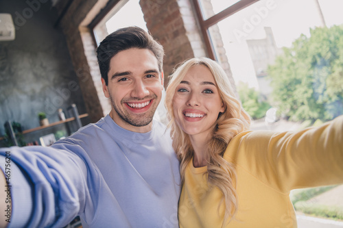 Self-portrait of attractive trendy cheerful couple staying spending free time at home loft industrial interior indoors #465756201
