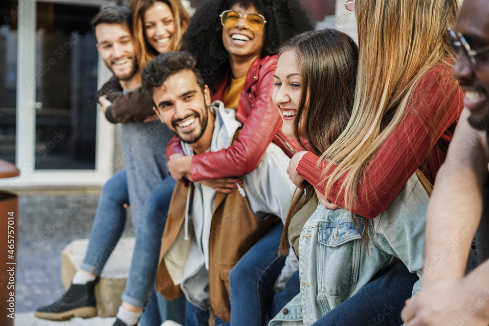 Fototapeta premium Young multiracial people having fun outdoor in the city - Soft focus on right girl face