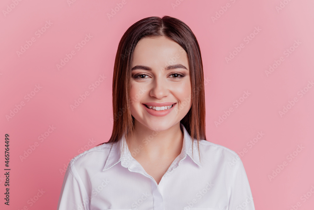 Photo of cheerful young girl good mood confident smart agent manager leader isolated pink color background Photo of cheerful young girl good mood confident smart agent manager leader isolated pink color background