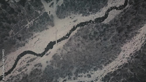 Storm, snowfall in a huge in the valley of the Aktru River, Altai mountains. Cloudy weather, wildlife, winter forest, flowing mountain river in the valley of the Chuya River and Aktru Altai Republic