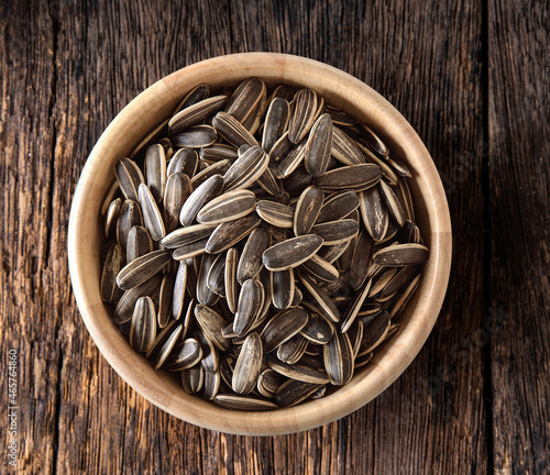 Sunflower seeds in wood bowl photo