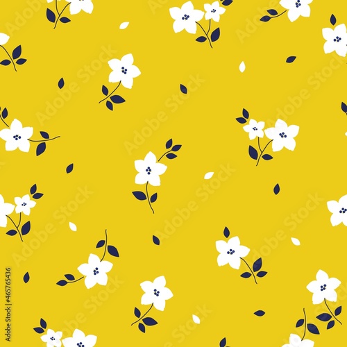 Vintage floral background. Seamless vector pattern for design and fashion prints. Elegant floral pattern with white flowers on a yellow background.