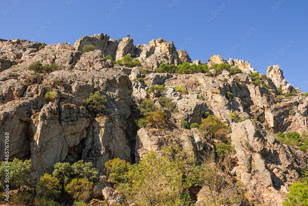 Look up at the steep cliffs of the Despenaperros gorge seen from a vantage point in the gorge