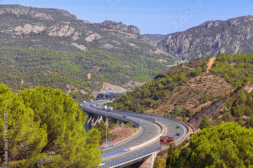 Highway winding through the Despenaperros gorge seen from a vantage point in Santa Elena. Distant features are blurred by the heath. © Vermeulen-Perdaen