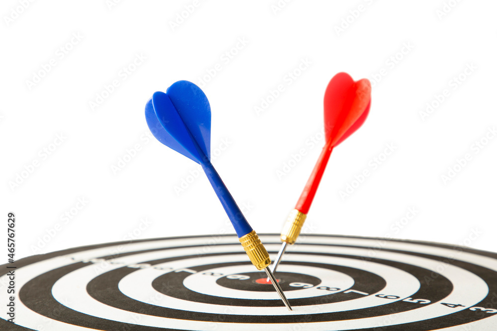 Close up shot red dart arrow on center of dartboard isolated on white, metaphor to target success, winner concept. Close up shot red dart arrow on center of dartboard isolated on white, metaphor to target success, winner concept.