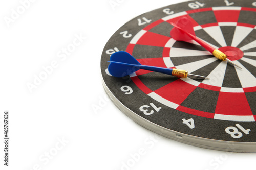 Dart board with blue dart isolated on white background.