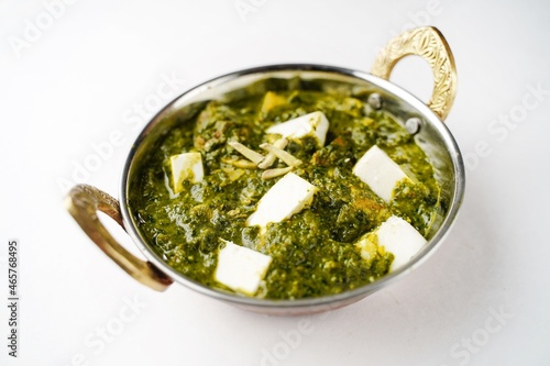 Palak Paneer isolated on white - Indian cottage cheese with spinach, selective focus