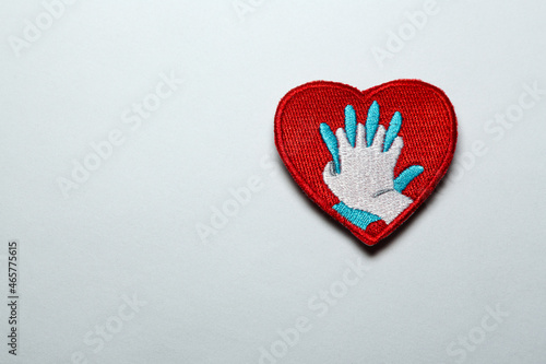 Heart shaped badge with CPR icon isolated on a white background with free space for tex, on the right.