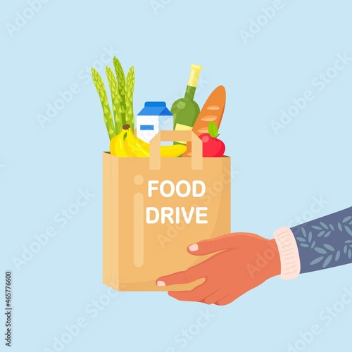 Volunteer holding a donation box with food for hunger people. Different grocery products for homeless people in shelter. Solidarity and charity concept. Vector design