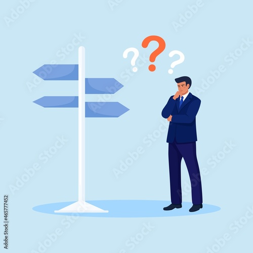 Confused businessman on crossroad looks at sign board choosing direction. Pensive man standing and making business decision. Person choosing work strategy for success. Life choices, questions dilemma.