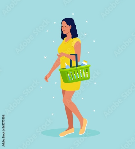 Young woman with shopping basket full of food and drinks in supermarket. Vector illustration