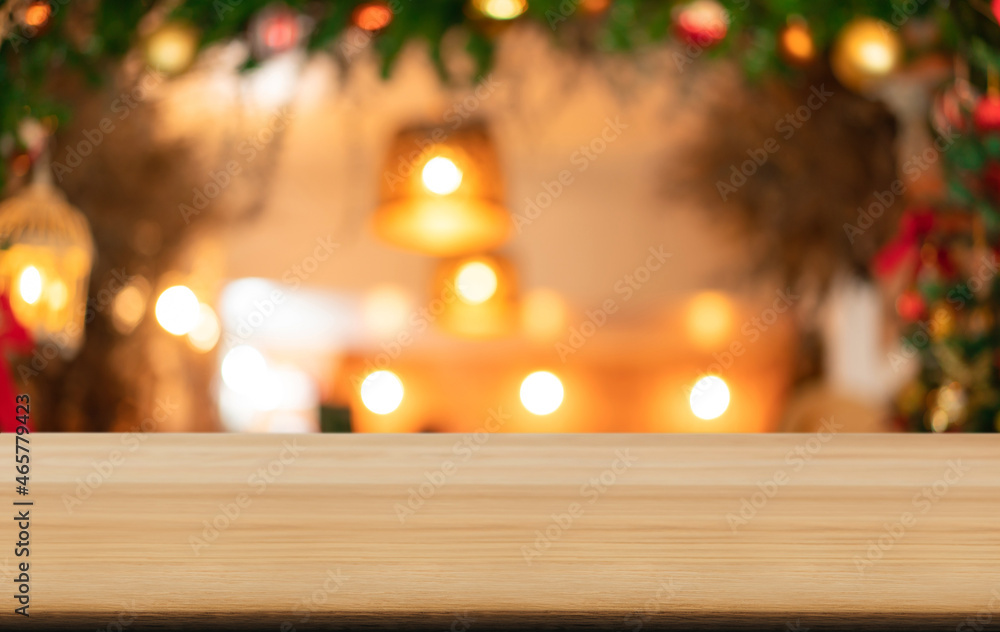 Empty wooden table and blurred Christmas background of abstract in front of coffee shop or restaurant for display of product or for montage Empty wooden table and blurred Christmas background of abstract in front of coffee shop or restaurant for display of product or for montage