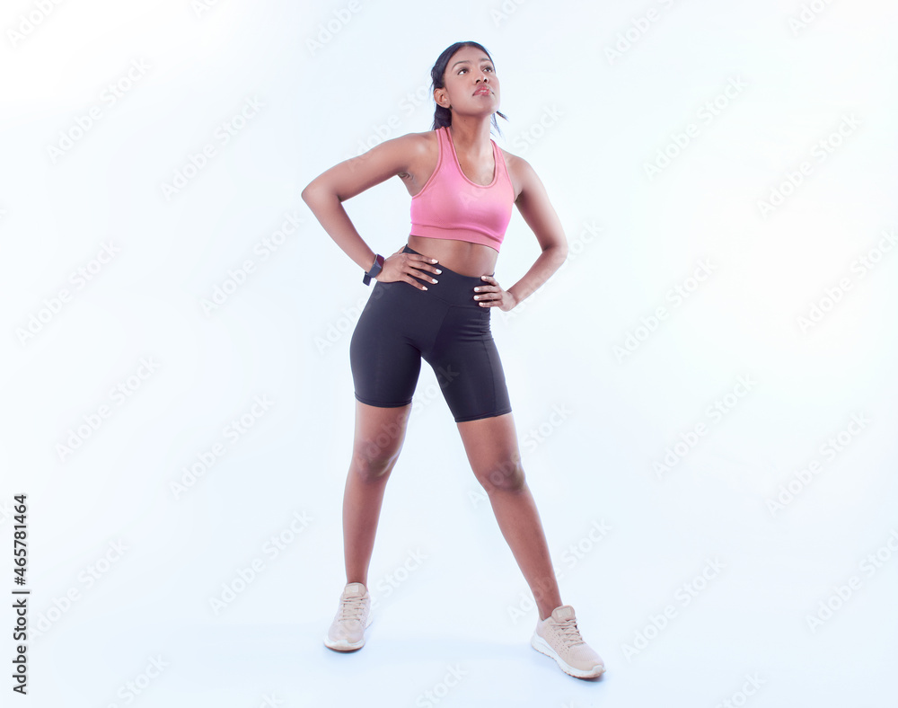 Black female working out on a white background